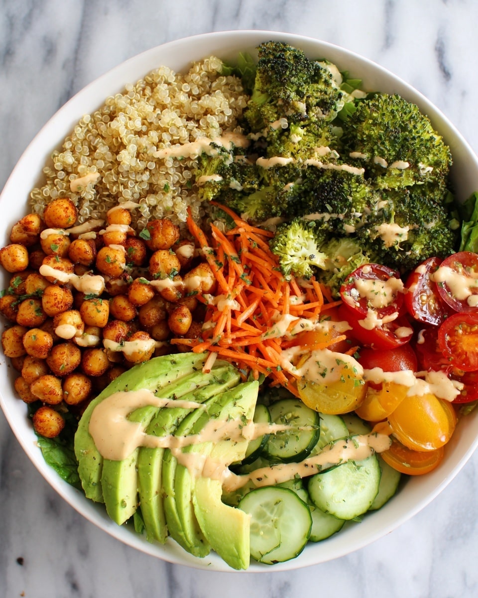 A white bowl filled with seven distinct layers starting from the top left: fluffy cooked quinoa in small pale beige grains, golden roasted chickpeas, bright green broccoli florets, thinly sliced light green avocado fan on dark green lettuce, thin orange shredded carrots, green cucumber slices mixed with more broccoli, and halved red and yellow cherry tomatoes. All layers are drizzled with a creamy beige dressing and sprinkled with green herbs and seasoning, placed on a white marbled surface photo taken with an iphone --ar 4:5 --v 7